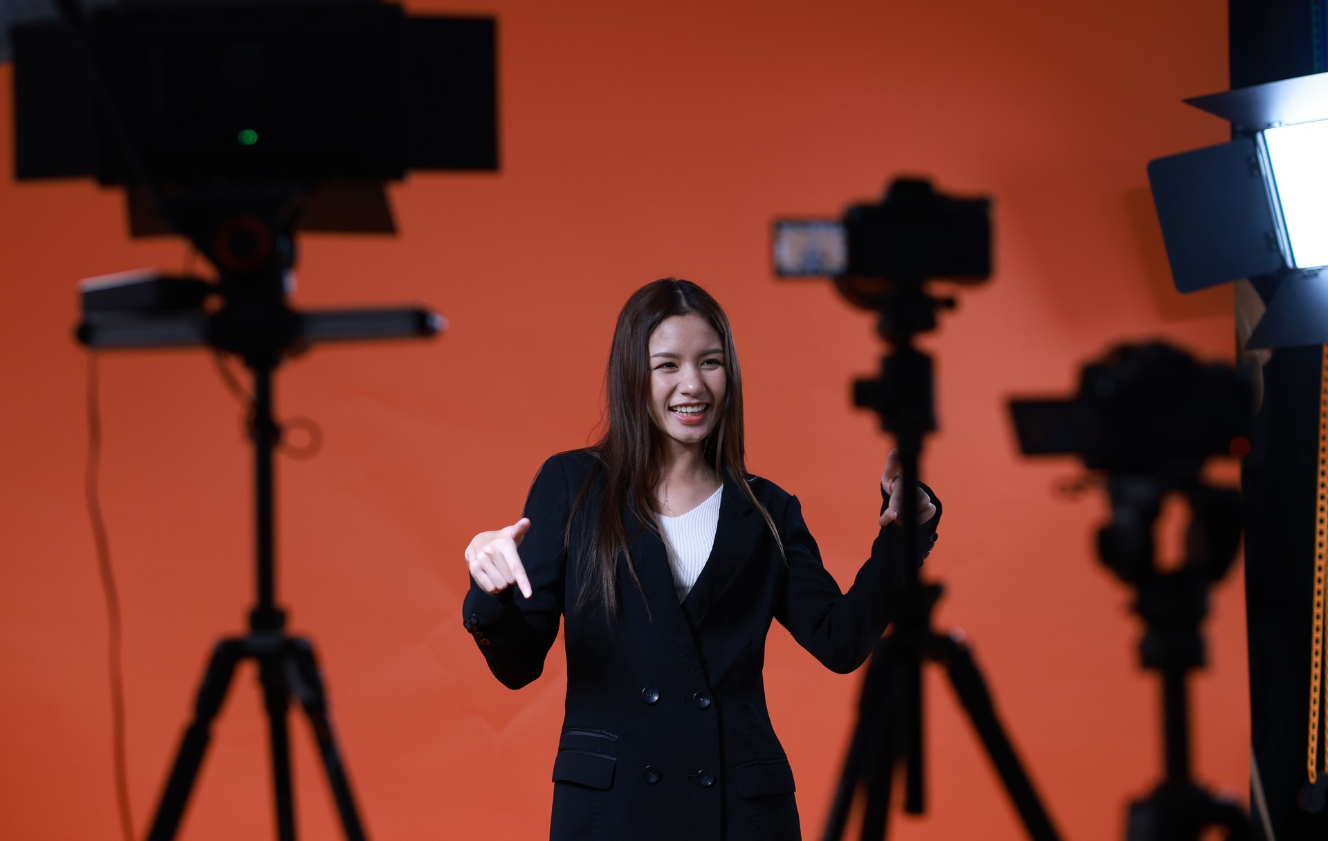 Back state of a young  female model in studio  steadicam during the shooting of a commercial  advertisement